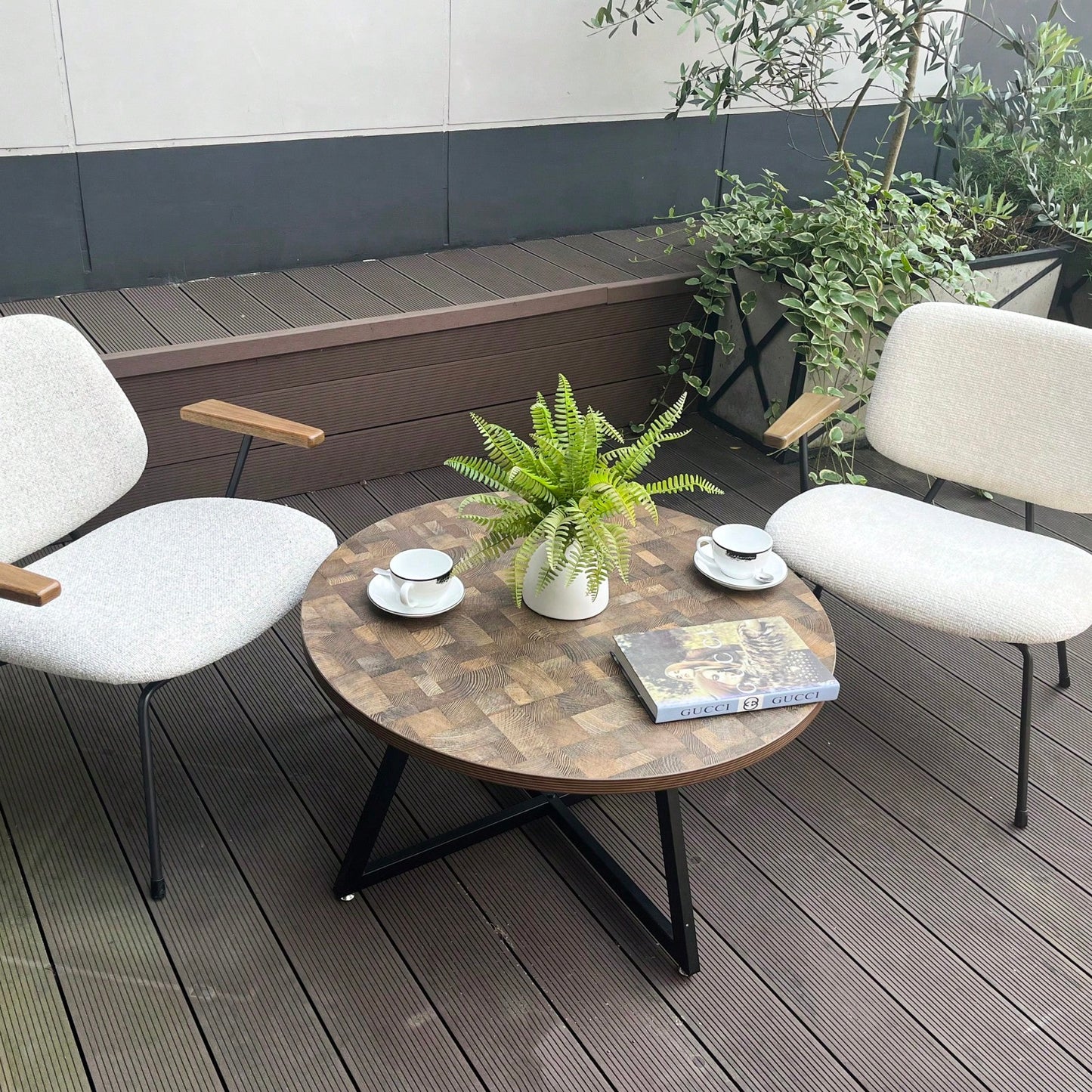 Round Coffee Table With Friendly Wood Grain Top And Sturdy Black Metal Frame For Modern Living Spaces