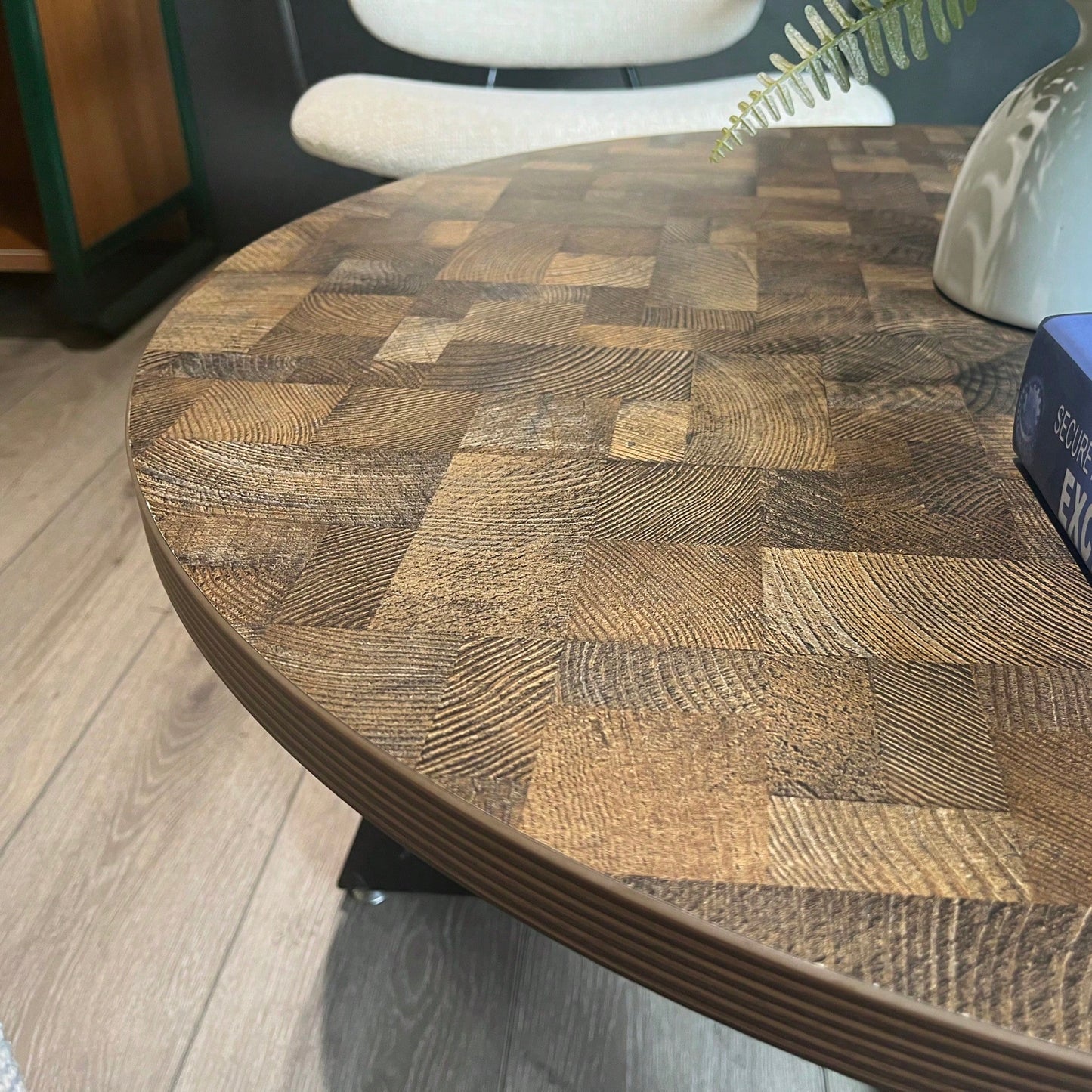 Round Coffee Table With Friendly Wood Grain Top And Sturdy Black Metal Frame For Modern Living Spaces