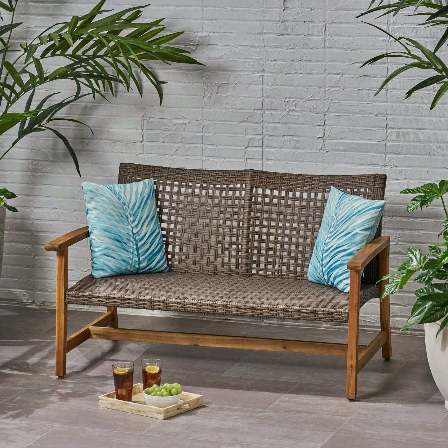 Cozy Outdoor Wicker Loveseat With Plush Cushions For Relaxing Patio Seating