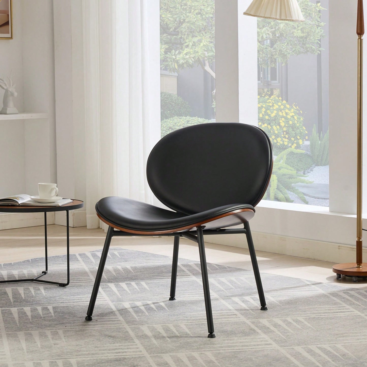Mid-Century Modern Black Leather Lounge Chair With Walnut Finish Comfortable Backrest And Tripod Design