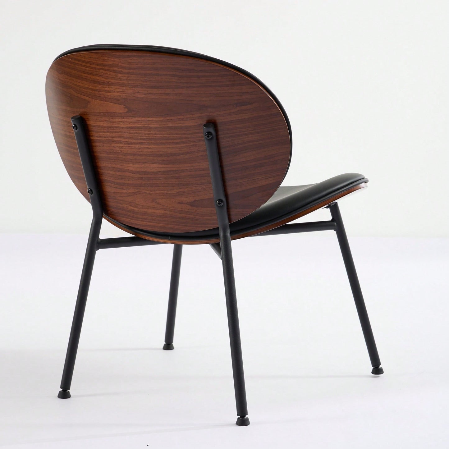 Mid-Century Modern Black Leather Lounge Chair With Walnut Finish Comfortable Backrest And Tripod Design