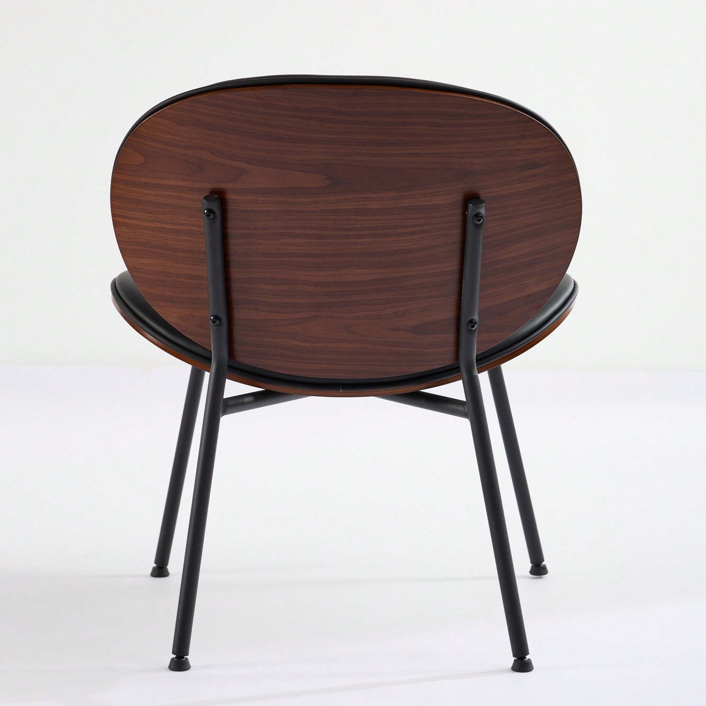 Mid-Century Modern Black Leather Lounge Chair With Walnut Finish Comfortable Backrest And Tripod Design