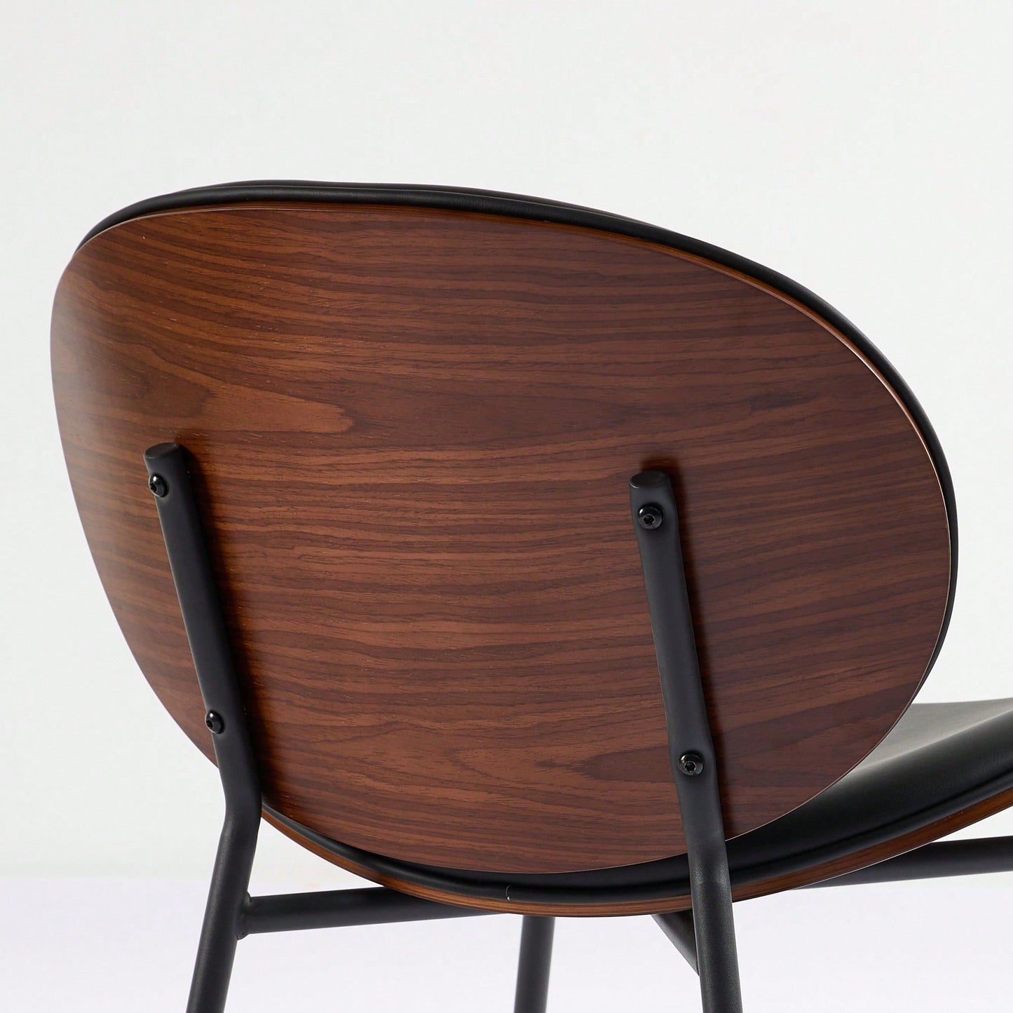 Mid-Century Modern Black Leather Lounge Chair With Walnut Finish Comfortable Backrest And Tripod Design