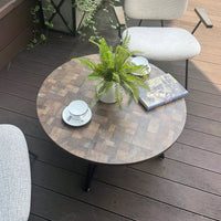 Round Coffee Table With Friendly Wood Grain Top And Sturdy Black Metal Frame For Modern Living Spaces