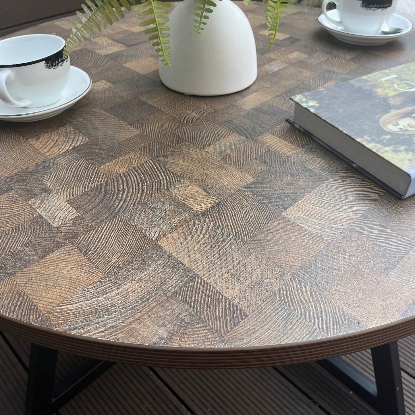 Round Coffee Table With Friendly Wood Grain Top And Sturdy Black Metal Frame For Modern Living Spaces
