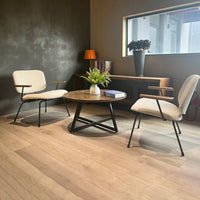 Round Coffee Table With Friendly Wood Grain Top And Sturdy Black Metal Frame For Modern Living Spaces