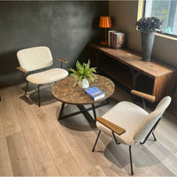 Round Coffee Table With Friendly Wood Grain Top And Sturdy Black Metal Frame For Modern Living Spaces