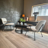 Round Coffee Table With Friendly Wood Grain Top And Sturdy Black Metal Frame For Modern Living Spaces