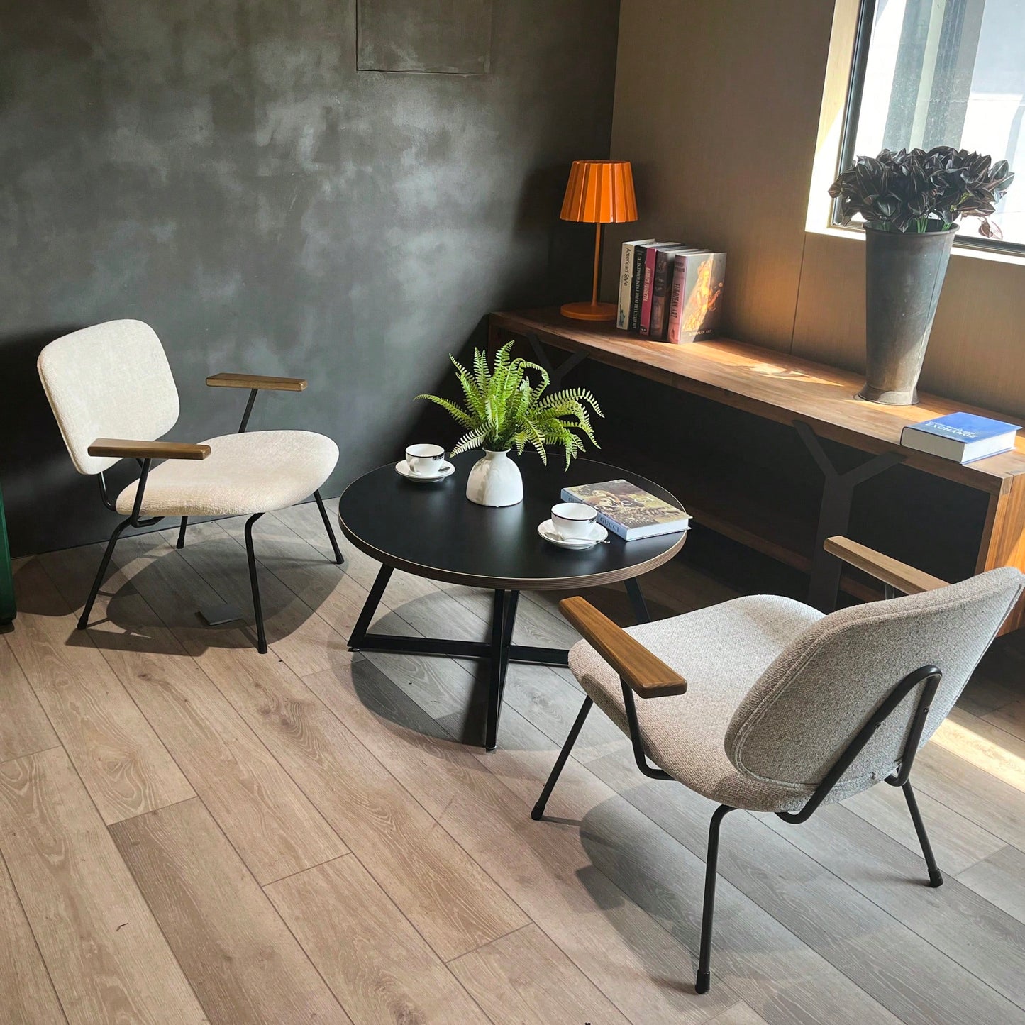Round Coffee Table With Friendly Wood Grain Top And Sturdy Black Metal Frame For Modern Living Spaces