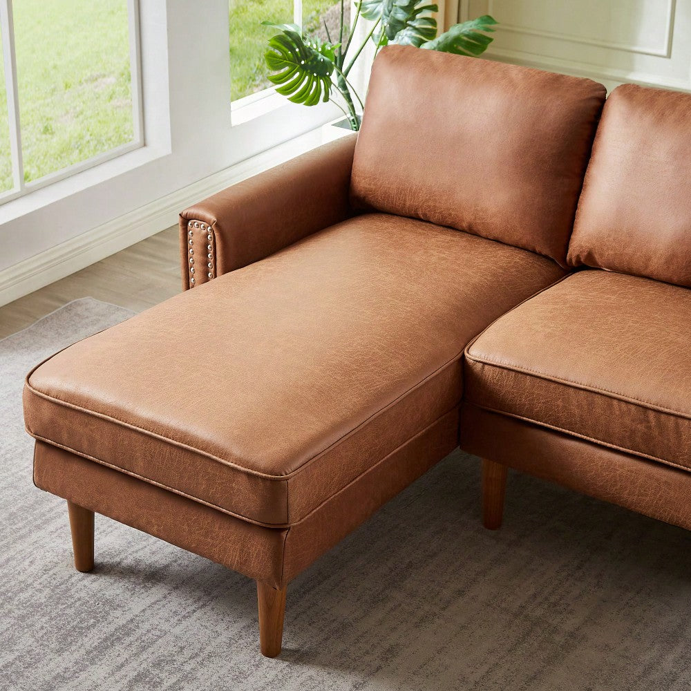 L-Shape Sofa Couch With Chaise In Brown Suede Fabric And Copper Nail Trim, Stylish Wooden Legs For Modern Living Spaces